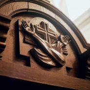 Wooden window of confessional box at church. Background