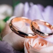 wedding rings on a bouquet of flowers